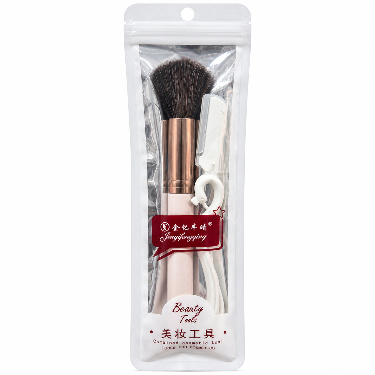 Pale pink makeup brush with dark bristles beside white beauty tools in packaging